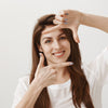 young woman making capture gesture, skincare result skinsos