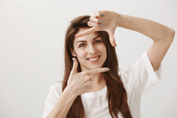 young woman making capture gesture, skincare result skinsos